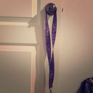 The necklace chain can hold keys, badges and money